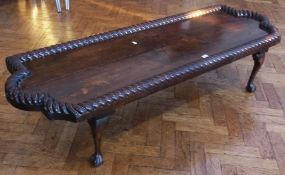 An oak rectangular shaped coffee table, top (possibly made from a bed headboard), on cabriole