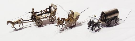 Dutch silver coloured metal model of a Troika-type carriage, with two figures and pulled by a single