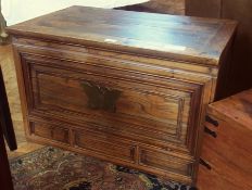 An Oriental style hardwood trunk, with drop down hinged panelled door to front enclosing two