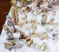 10 tinted bisque and other porcelain continental figures, similar posy holder, seated figure of girl