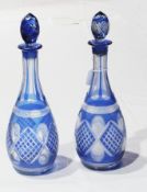 Pair blue overlay flash and slashed glass wine decanters, each bulbous with tapering panelled