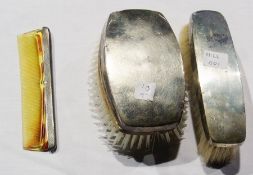 Two 1920's silver backed clothesbrushes and a later silver mounted comb, Birmingham, various dates