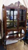 Early 20th century continental marquetry inlaid mahogany china display cabinet, serpentine front