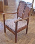 20th century caned and carved back open arm fireside chair