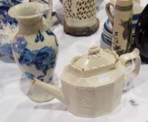 Castleford type stoneware teapot, the sliding panel lid with foliate finial, raised arched edge to