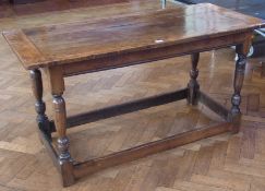 Antique oak refectory table (possibly Scottish), with carved panel to top on turned tapering