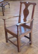 Antique oak open armchair the back with shaped  toprail, inverse baluster shaped splat, panelled