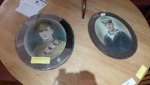 A pair of World War One watercolour portraits of military gentlemen in oval bevelled mirrored