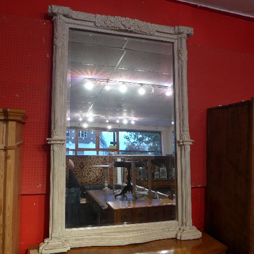 An Indian distressed finish hardwood framed mirror with carved detail