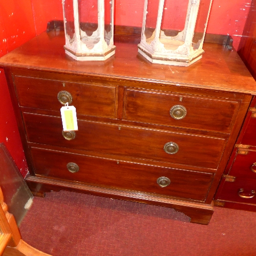 An Edwardian mahogany chest fitted two short and two long drawers on plinth base