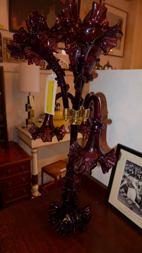 An amethyst coloured glass epergne of seven branches