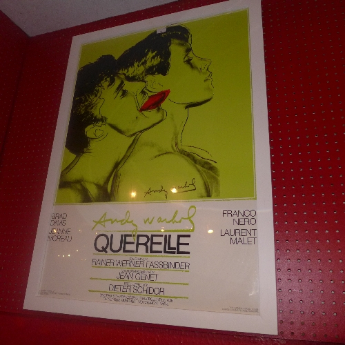 An Andy Warhol poster for the film `Querelle` in green glazed and framed   99 x 69 cm