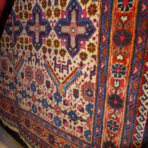 An extremely fine North West Persian Afshar rug repeating stylized petal and animal motifs on an