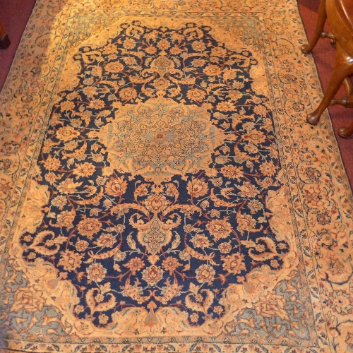 An extremely fine antique central Persian Esfahan rug the central pendant medallion on a sapphire