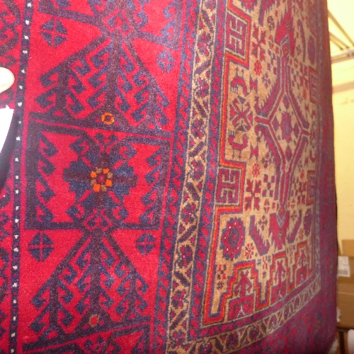 A fine North east Persian Meshad Belouch rug bearing triple pole medallion on a golden field within