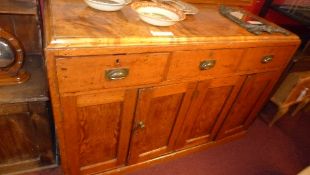 A pitch pine artist`s cabinet the gallery back over three short drawers and four cupboard doors W