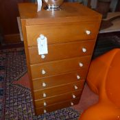 A pair of Danish pine tall chests fitted seven drawers with plastic handles