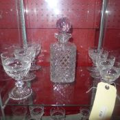 A suite of drinking glasses and a cut glass decanter with stopper