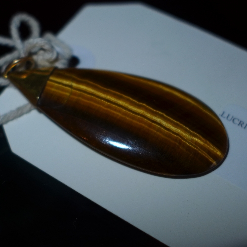 A Tigers eye and gold mounted pendant