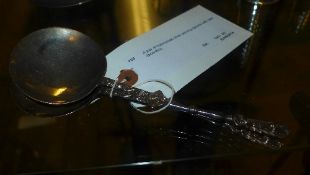 A pair of hallmarked silver serving spoons with cast decoration