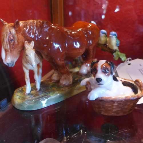 A Royal Doulton figural group of a horse with a foal together with a dog in a basket and a Crown