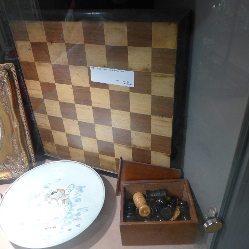 A bygone wood chess pieces and board