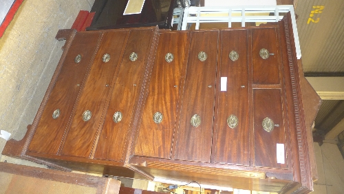 A George III mahogany chest on chest on bracket feet with inlaid stringed sides raised on bracket