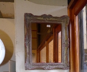 SOLD IN TIMED AUCTION A pier mirror in gilded swept frame