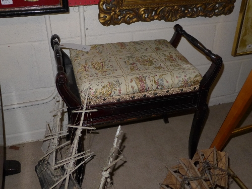 An Edwardian mahogany piano stool and a gilded wall mirror