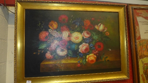 An oil on canvas Dutch School still life  of flowers on a table in gilded frame