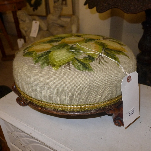 A Victorian mahogany stool with needlework seat