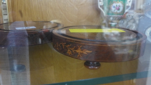 A pair of Victorian inlaid rosewood stands