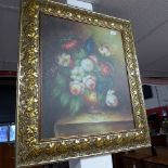 An oil on canvas still life of flowers in gilt frame