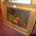 An Edwardian oil on board of fruit signed Reynolds in a gilt frame