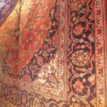 A fine central Persian Keshan rug 208 X 135 cm central pendant medallion on a rouge field within