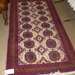 A hand knotted Persian rug the beige gro