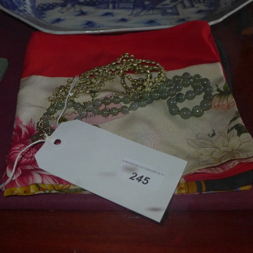 A Gucci silk scarf another a jade necklace with silver gilt clasp and a bijou necklace