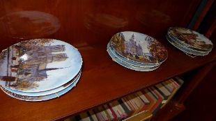 A set of twelve Limoges porcelain seriesware wall plates and Royal Doulton similar