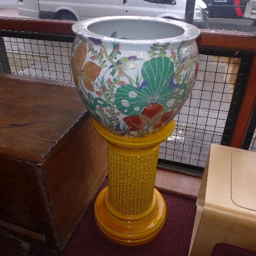 A pair of mid to late C19th Burmandtofts jardiniere stands in a yellow glaze together with a pair