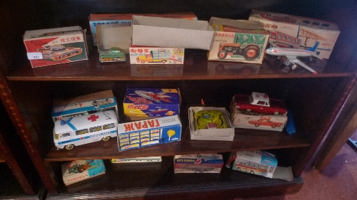 A large collection of tin plate toys including cars, tanks, tractors, ambulances and others mainly