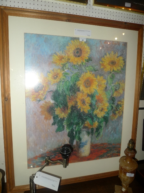 A framed and glazed coloured print of sunflowers after Monet W 60 H 75 cm
