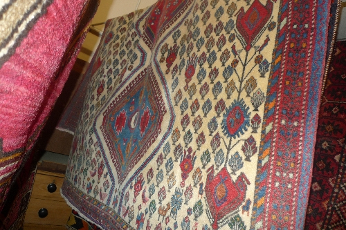 A fine South Central Persian Abadeh rug with triple medallion on ivory field and allover floral and