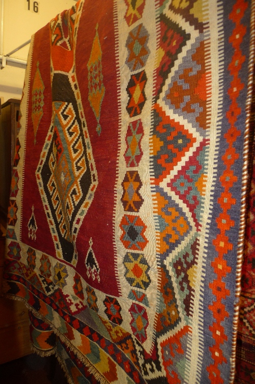 A Persian hand knotted kilim carpet with good multi coloured geometric decoration L 320 cm x W 160
