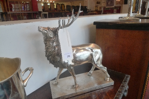 A pair of silvered models of stags H 38 cm