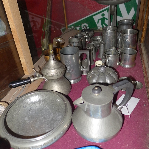 A collection of pewter items including a tazza tankards and other similar H 3-25 cm