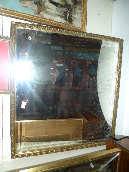 A gilt framed wall mirror of rectangular form having a bevelled plate W 74 cm x H 80 cm