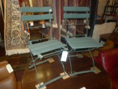 A set of 4 folding garden chairs painted green (A/F)