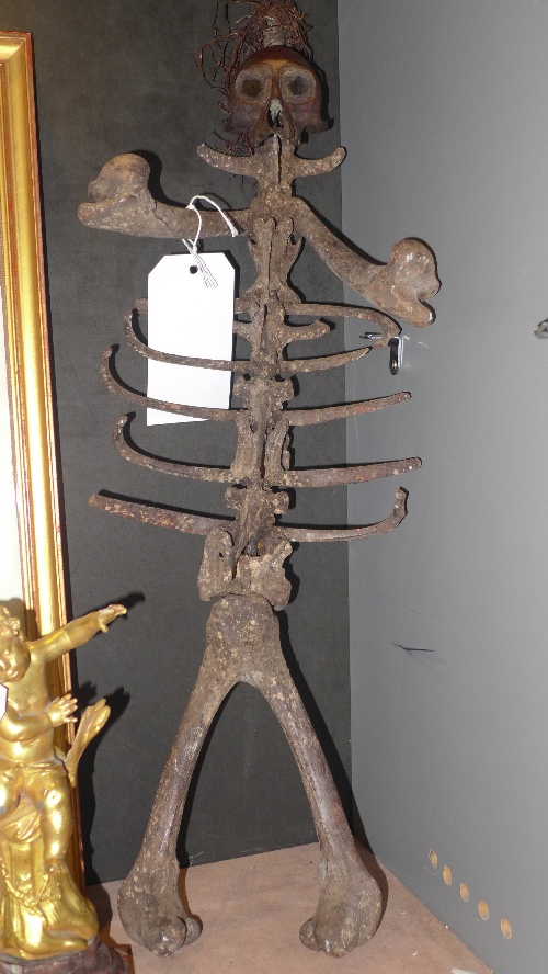 An African baule witch doctor staff, with monkey skull bone surmount h 68 cm