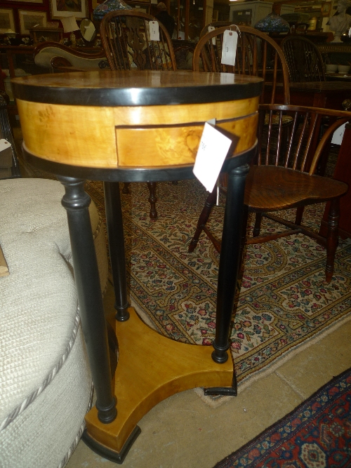 A pair of blondwood circular top tables with frieze drawers united by undertiers W 42 H 78 cm