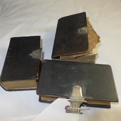 Three silver clasp bibles